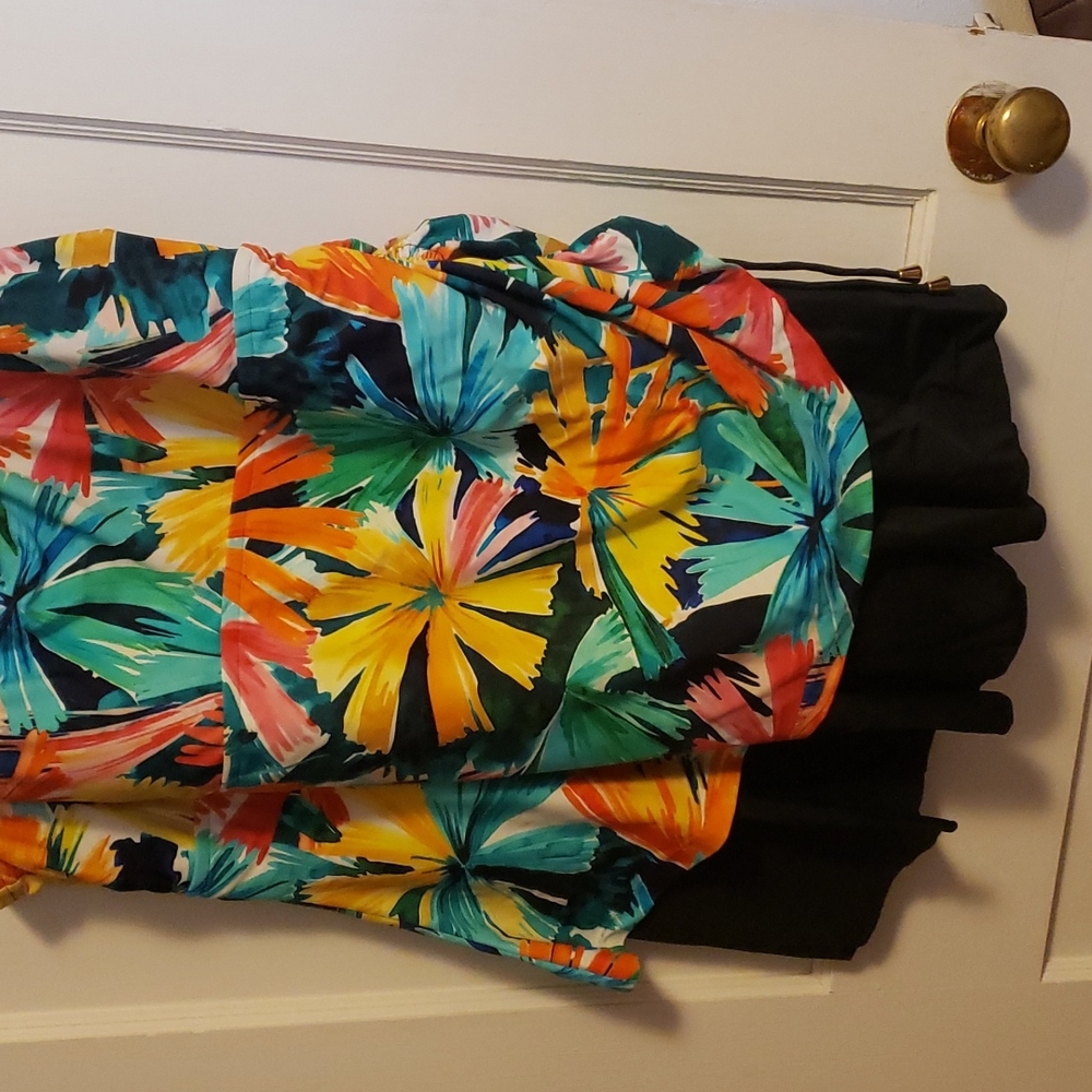 Very colorful like new one piece with skirt attached also has bra insert